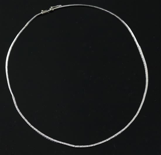 A modern 750 white gold and diamond set fine link line necklace, 39cm.